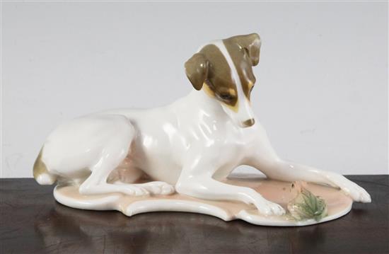 A Nymphenburg polychrome figure of a recumbent hound and frog, modelled by T. Karner, late 20th century, length 17cm (6.7in.)